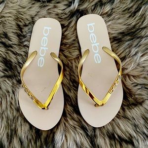 BEBE flip flops gold and Tan.
